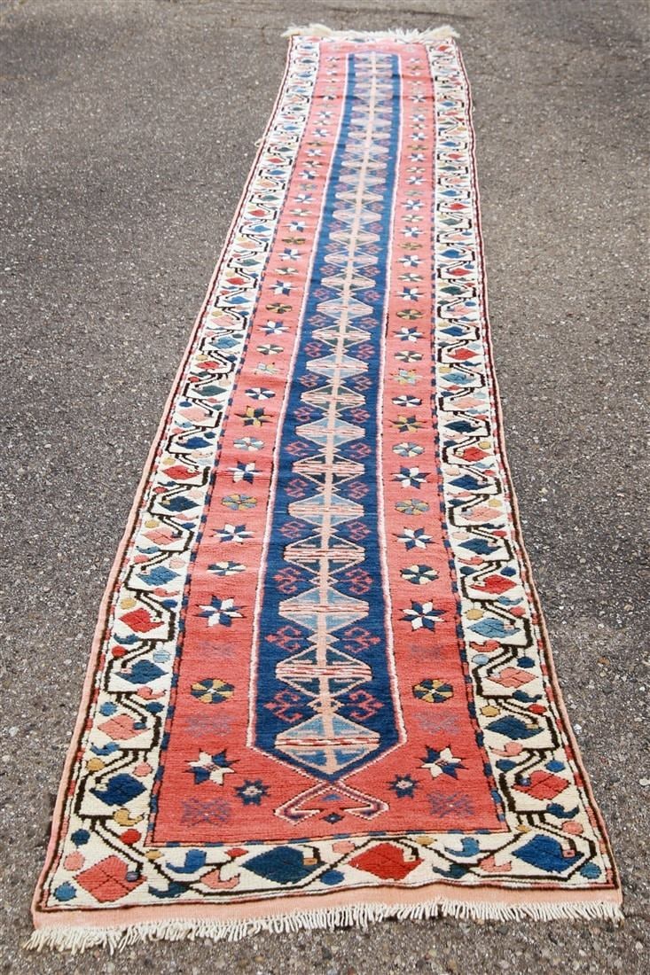 Turkish Wool Runner, c. 1990s: Turkish. Wool, c. 1990s. 2'5" x 17'3". Wool warp and weft Turkish runner rug in rust, navy, and cream colors. Seal tag on the side.