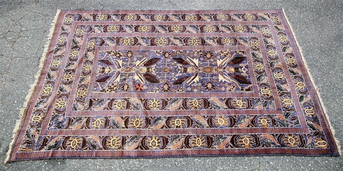 Afghani Wool Rug, c. 1980s: Afghanistan. Wool, c. 1980s. 6'9" x 10'1". Wool Afghani rug in blue, purple, gold, and beige colors.