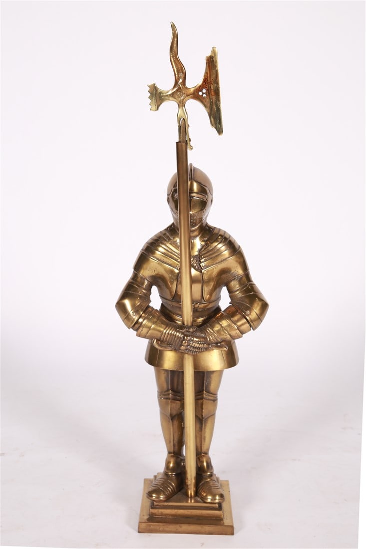 Brass Knight Fireplace Tool Set: Brass. Height: 34 1/2", Length: 10 1/2", Depth: 6 3/4". Brass knight in a suit of armor fireplace tool set. Includes a brush, a set of tongs, and a poker.