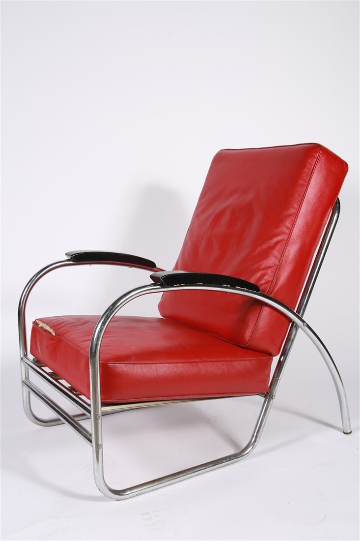 Royalchrome, Red Vinyl and Chrome Chair: Royalchrome. Vinyl, chromed tubular metal. Height: 35 1/4", Length: 25", Depth: 34". Red vinyl chair with tubular chromed metal frame with black painted wood armrests. Marked with Royalchrome label
