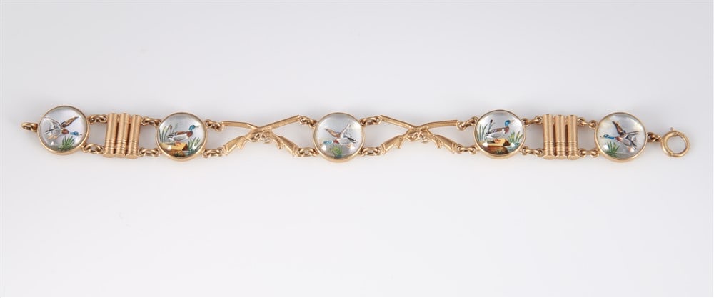 14k Yellow Gold "Duck Hunt" Bracelet: 14k yellow gold, crystal. Length: 7 1/4". Weight: 24.9 grams. 14k yellow gold link bracelet set with five reverse painted crystal domes in a duck hunt theme. Each dome has a 14k yellow gold back. Brac
