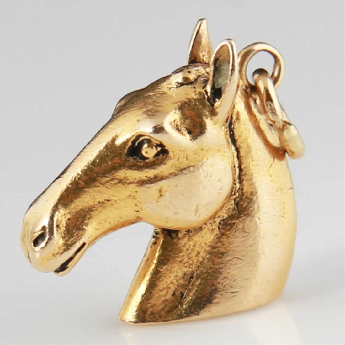 14k Yellow Gold Horse Head Charm: 14k yellow gold. 3/4" x 3/4". Weight: 8.6g. 14k yellow gold horse head charm. Unmarked, tests as 14k.