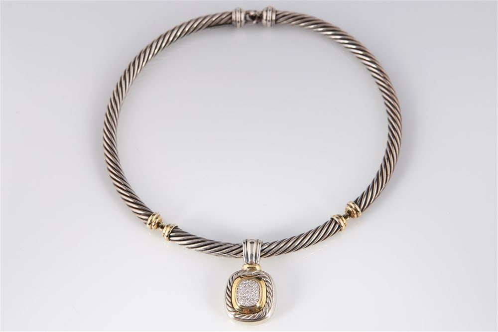 David Yurman Cable Collar and Enhancer: Sterling, 18k yellow gold, diamond. Weight: 3.875 ozt. David Yurman cable collar necklace in sterling silver and 18k yellow gold with a sterling, 18k yellow gold, and diamond enhancer pendant. Collar 