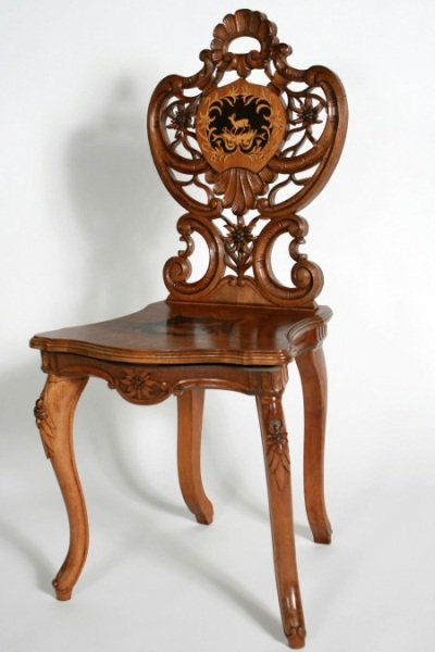 Black Forest Inlaid Walnut Music Chair, German: Black Forest inlaid walnut music chair. German, early 20th century. With pierced foliate carved back over shaped seat inlaid with a reserve of a deer on cabriole legs. Height 37". Condition: Appears f
