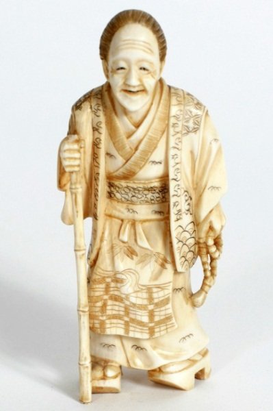 Carved Ivory Figure of a Scholar, Japanese, 20th C: Carved ivory figure of a scholar. Japanese, 20th century. Holding a walking stick and prayer beads. Signed. Height 4". Condition: Appears fine.