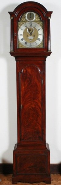 George II Mahogany Tall Case Clock, Mid-18th C.: George II mahogany tall case clock. Mid-eighteenth century. With projecting arched cornice over hood with glazed door enclosing Roman numeral dial marked "Rich Grant, London", and flanked by stop flut