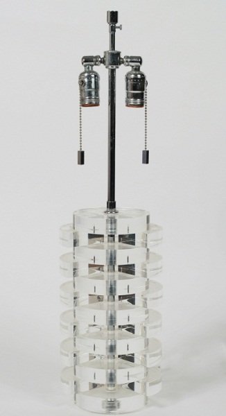 Lucite Table Lamp In the Style of Karl Springer: Lucite table lamp. American, 20th century. In the style of Karl Springer. Comprised of stacked circles and triangles. Height 26".