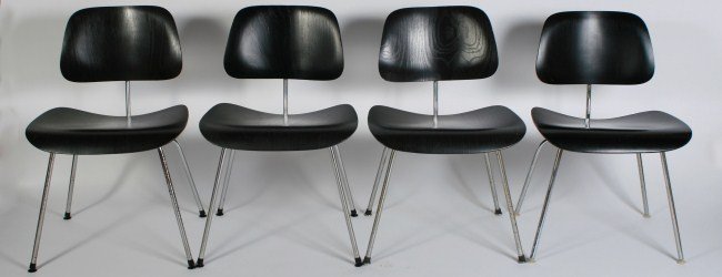 Group of Four Charles and Ray Eames DCM Chairs: Group of Four Charles and Ray Eames DCM chairs. American, 20th century. Made by Herman Miller. Ebonized plywood seat and back on chrome-plated steel frame. Height 30 1/2", width 19 1/4", depth 20 1/2"