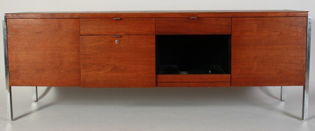 Stow Davis Mahogany Credenza: Stow Davis mahogany and chromed steel credenza. American, circa 1950s. Mahogany credenza on chromed steel frame with two doors and four drawers with chrome pulls. Height 26 1/2", width 74", depth 20".