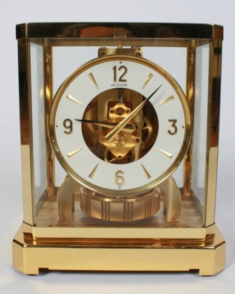 Jaeger LeCoultre Atmos Clock: Jaeger LeCoultre Atmos Clock. Swiss made. Brass with glass paneled case. Height 9 1/4", width 7 1/2", depth 6 1/2". Condition: Appears fine.