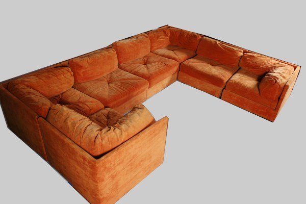 Selig Upholstered Sectional: Selig upholstered sectional sofa. American, circa 1970. Orange velour upholstered L-shaped sectional having seven sections. Each piece with a Selig/Monroe tag. Height 26", width of each section 31", d