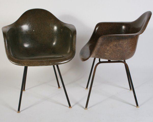Pair Charles & Ray Eames Shell Chairs: Pair of Charles and Ray Eames molded fiberglass shell chairs. American, 20th century. Made by Herman Miller. Molded olive green fiberglass shell chairs with black tubular metal legs ending in white ny