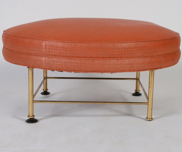 Mid-Century Ottoman in the Style of Paul McCobb: Mid-century ottoman in the style of Paul McCobb. American, mid 20th century. Round ottoman with printed vinyl upholstery on slim cylindrical brass legs on black feet. Unmarked. Height 14", diameter 31