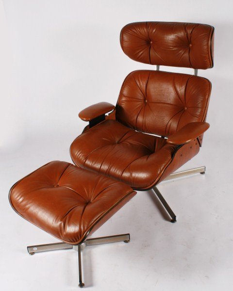 Selig Eames Style Lounge Chair and Ottoman: Selig Eames style lounge chair and ottoman. Molded walnut shells with caramel-colored Naugahyde upholstered cushions raised on an aluminum and chromed metal base. Signed with Selig paper labels to bas