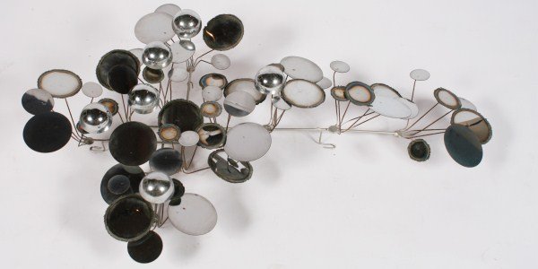 "Raindrops" Wall Sculpture Attrib. to C. Jeré: "Raindrops" wall sculpture attributed to C. Jeré. 20th century. Wall sculpture having polished and burnished chromed metal disks and half-globes. Unmarked. Height 25", width 37", depth 9".
