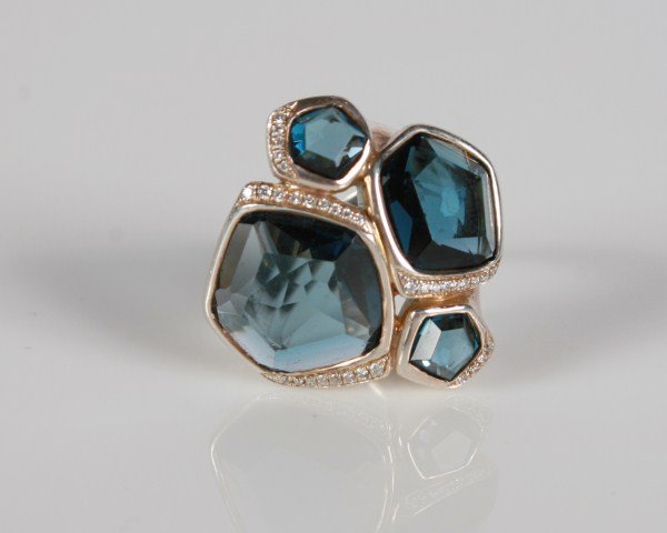 Ippolita Wicked Topaz and Diamond Ring: Ippolita Wicked ring. 20th century. Sterling ring set with faceted topaz and diamonds, total weight .17 ct. Total weight 15.5 grams.