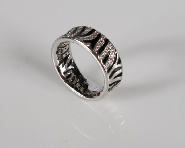 Roberto Coin Zebra Stripe Diamond and Enamel Ring: Roberto Coin Zebra 18 karat white gold ring set with diamonds and black zebra stripe enamel detail. 20th century. Ring size 6 1/2. Total weight 7.7 grams.