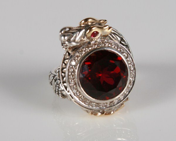 John Hardy Naga Batu Ruby Dragon Ring: John Hardy Naga Batu sterling silver and 18 karat yellow gold ring set with round-cut synthetic ruby surrounded by pavé diamonds. 20th century. All with a surrounding sterling silver and 18 karat yel
