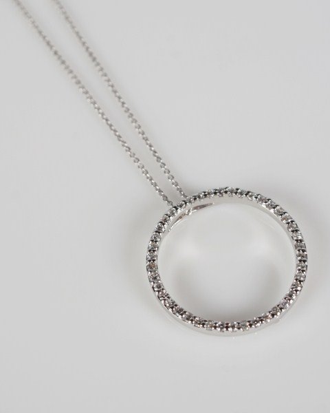 Roberto Coin Circle of Life Diamond Pendant: Roberto Coin Circle of Life 18 karat white gold pendant set with 42 brilliant cut diamonds, total weight 0.51 ct., Color G-H, Clarity SI1. Hanging from 16" 18 karat white gold cable chain having a lob