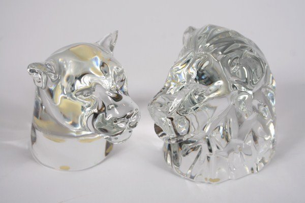 Pair Baccarat Crystal Lion Heads, 20th C.: Pair of Baccarat crystal lion heads. 20th century. Crystal lion and lioness head figurines. Both signed with etched "Baccarat" stamps. Height of lion head 5 1/2".