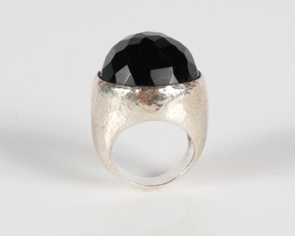 Ippolita Wonderland Sterling Silver and Onyx Ring: Ippolita Wonderland sterling silver and onyx ring. 20th century. Hammered sterling silver ring set with onyx face. Ring size 6. Total weight 27.2 grams.