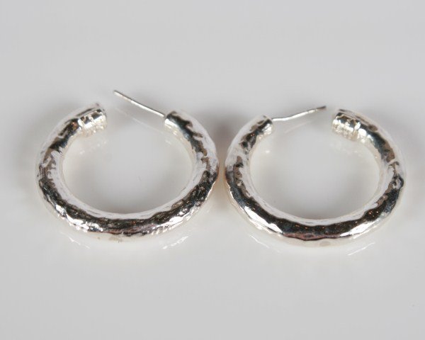 Ippolita Hammered Sterling Silver Hoop Earrings: Ippolita hammered sterling silver hoop earrings. 20th century. Total weight 10.2 grams.