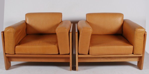Pair Tobia Scarpa Bastiano Lounge Chairs for Knoll: Pair of Tobia Scarpa "Bastiano" lounge chairs. 20th century. Made by Knoll International. Lounge chairs having wood frames and brown leather upholstered cushions. With manufacturer's label to undersid