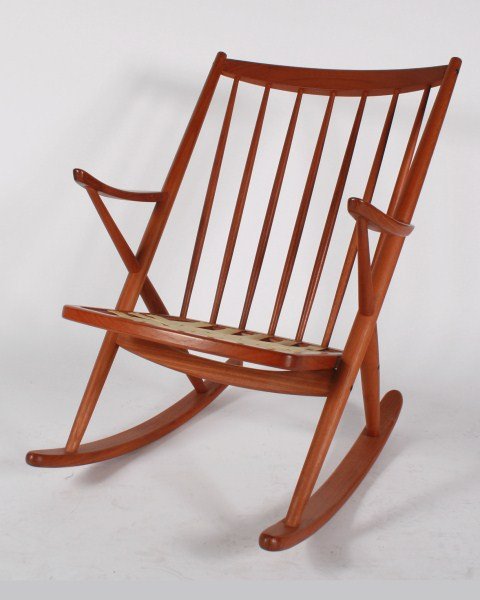 Frank Reenskaugh Rocking Chair for Bramin: Danish wood rocking chair designed by Frank Reenskaugh. Danish, 20th century. Manufactured by Bramin. Wood rocking chair having a woven strap seat. Marked "Bramin Made in Denmark" and "Furniture Maker