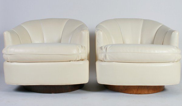 Attrib. Milo Baughman for Thayer Coggin Tub Chairs: Group of four tilt-swivel tub chairs attributed to Milo Baughman for Thayer Coggin. American, 20th century. White naugahyde upholstered tub chairs raised on wood swivel bases. Unmarked. Height 26 1/4"