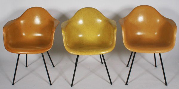 Group of 3 Eames Molded Fiberglass Armchairs: Group of three Charles and Ray Eames molded fiberglass shell armchairs. American, 20th century. Made by Herman Miller. Molded fiberglass shell armchairs raised on tubular metal frames. All chairs with