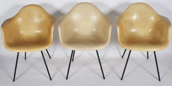 Group of 3 Eames Molded Fiberglass Armchairs: Group of three Charles and Ray Eames molded fiberglass shell armchairs. American, 20th century. Made by Herman Miller. Molded fiberglass shell armchairs raised on tubular metal frames. All chairs with