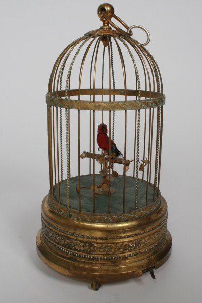 Automaton Griesbaum Singing Bird in Cage: An automaton Karl Griesbaum singing bird-in-cage music box. German, probably early 20th century. Mechanical movement with a side lever and base with manual winding. Marked "KG" for Karl Griesbaum and 