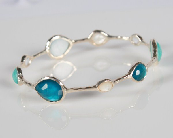 Ippolita Wonderland Teardrop Bangle: Ippolita Wonderland teardrop sterling silver bangle with semiprecious stones. Hammered sterling silver bangle set with clear crystal, mother-of-pearl, a turquoise doublet, and a mother-of-pearl aqua d