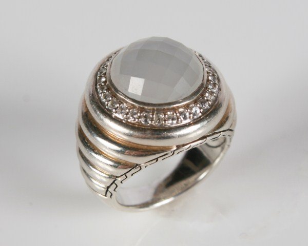John Hardy Batu Bedeg Round Ring: John Hardy Batu Bedeg sterling silver ring set with faceted moon quartz surrounded by white sapphires. 20th century. Ring size 6 1/2. Total weight 15.4 grams.