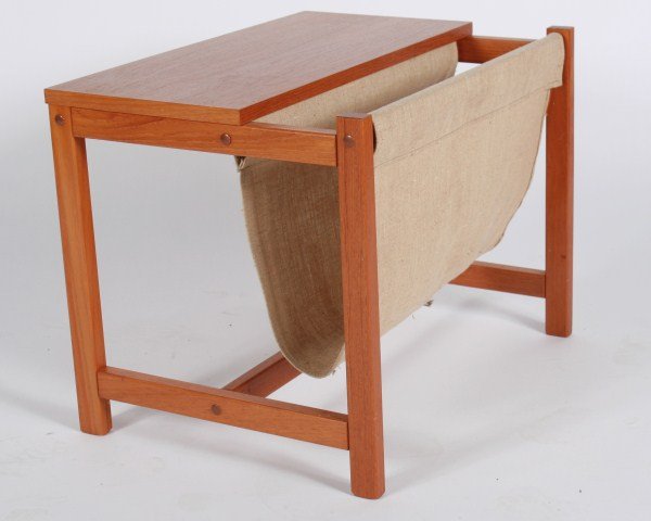Possibly Danish Magazine Rack: Possibly Danish magazine rack. Unmarked. Magazine rack having a teak frame and a fabric sling. Height 16 1/2", width 21 3/4", depth 16".