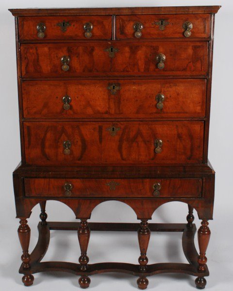 English William and Mary Walnut Highboy: English William and Mary walnut highboy. 18th century. Highboy having six drawers with brass pulls, and raised on six legs. Height 56", width 38". Provenance: From the Estate of Stephen Stackpole.