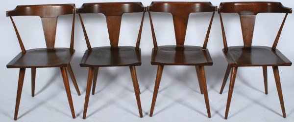 Group of 4 Paul McCobb Dining Chairs: A group of four Paul McCobb dining chairs for Planner Group. American, 20th century. Made by Winchendon Furniture Company. Four dining chairs having shaped seats and tapered legs. Three of the four ch