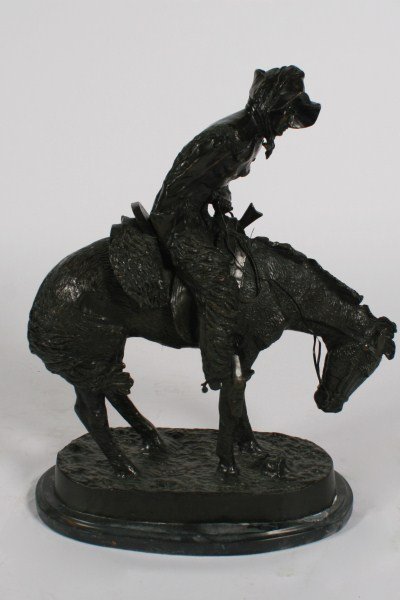 Bronze Sculpture After Frederic Remington: Bronze sculpture after "Norther" by Frederic Remington (American, 1861-1909). Signed "Frederic Remington" to bronze. Raised on a marble base. Height with base 22 1/2", width 17".