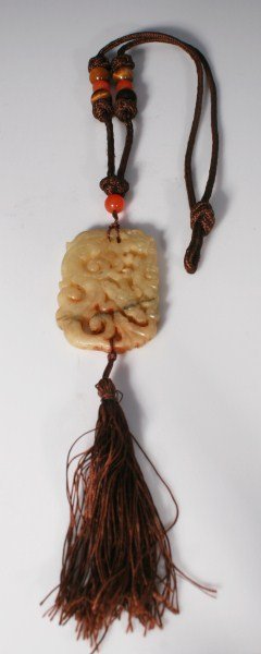 Ladies Carved Jade Pendant Necklace: Ladies carved jade pendant necklace with tiger eye and carnelian beads. Fabric necklace embellished with tiger eye and carnelian beads ending in a carved jade pendant. Total weight 41.7 grams.