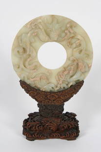 Chinese Jade Bi Ring: Chinese jade bi ring. Comes with original receipt dating piece to the Song dynasty (circa 960-1279). Jade bi ring is elaborately carved on one side, and is raised on a heavily carved wood stand. Diame