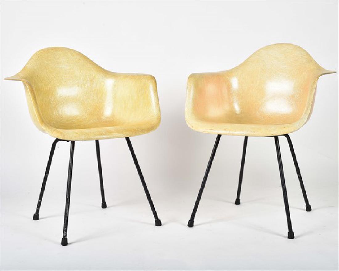 Pair of DAX Chairs by Eames for Herman Miller: Charles and Ray Eames for Herman Miller American, 20th century Fiberglass, round steel bars, and rubber Height 31 1/4", Width 24", Depth 23 1/2". Unupholstered molded fiberglass DAX shell armchairs wi