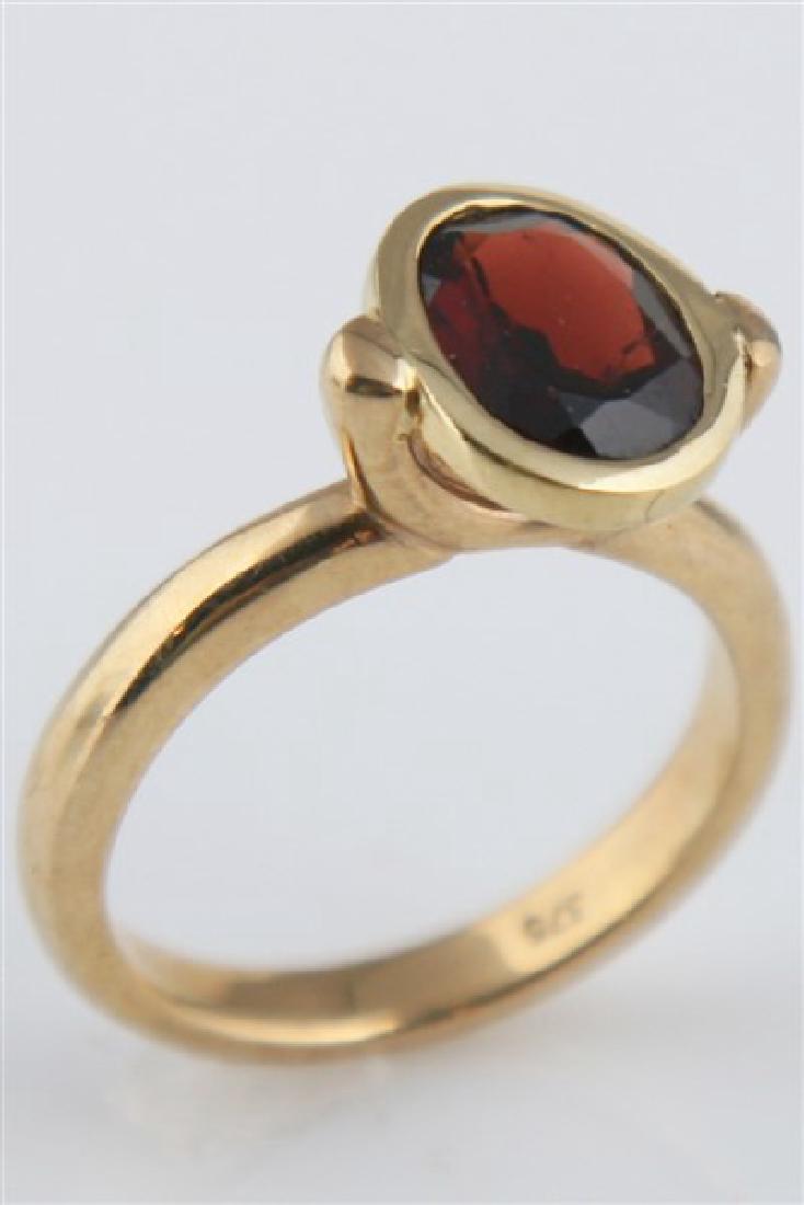 9k Yellow Gold and Garnet Ring: 9k yellow gold and garnet ring. Signed "375". Size 6. Weighing 4.6g.