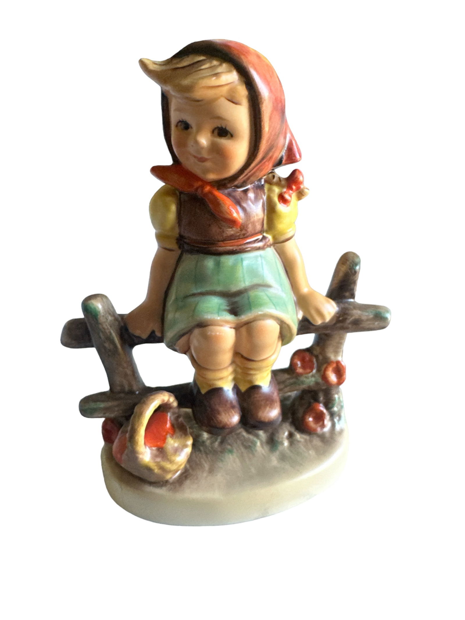 Goebel Hummel Vintage Just Resting figurine: Capture the timeless charm of vintage Goebel Hummel with this exquisite "Just Resting" figurine from 1938. Hand-painted with meticulous detail, it portrays a young girl resting on a fence with a sweet