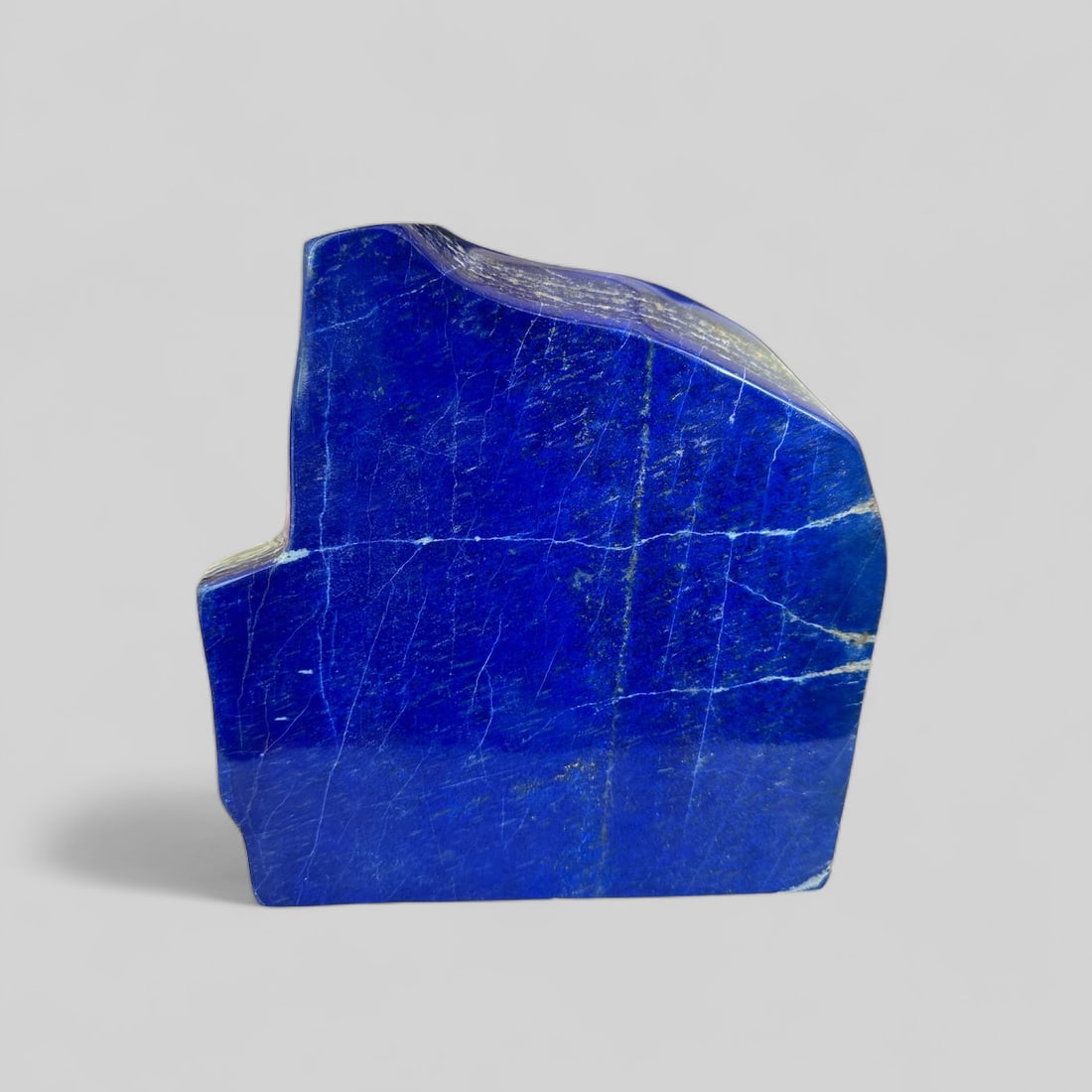 Lapis Lazuli Rough Polished Tumple Stone. 3.06 KG: Elevate your space with this Lapis Lazuli Rough Polished Tumble Stone, weighing 3.06 kilograms (6.75 pounds) and sourced from Afghanistan. Renowned for promoting communication, self-expression, and em