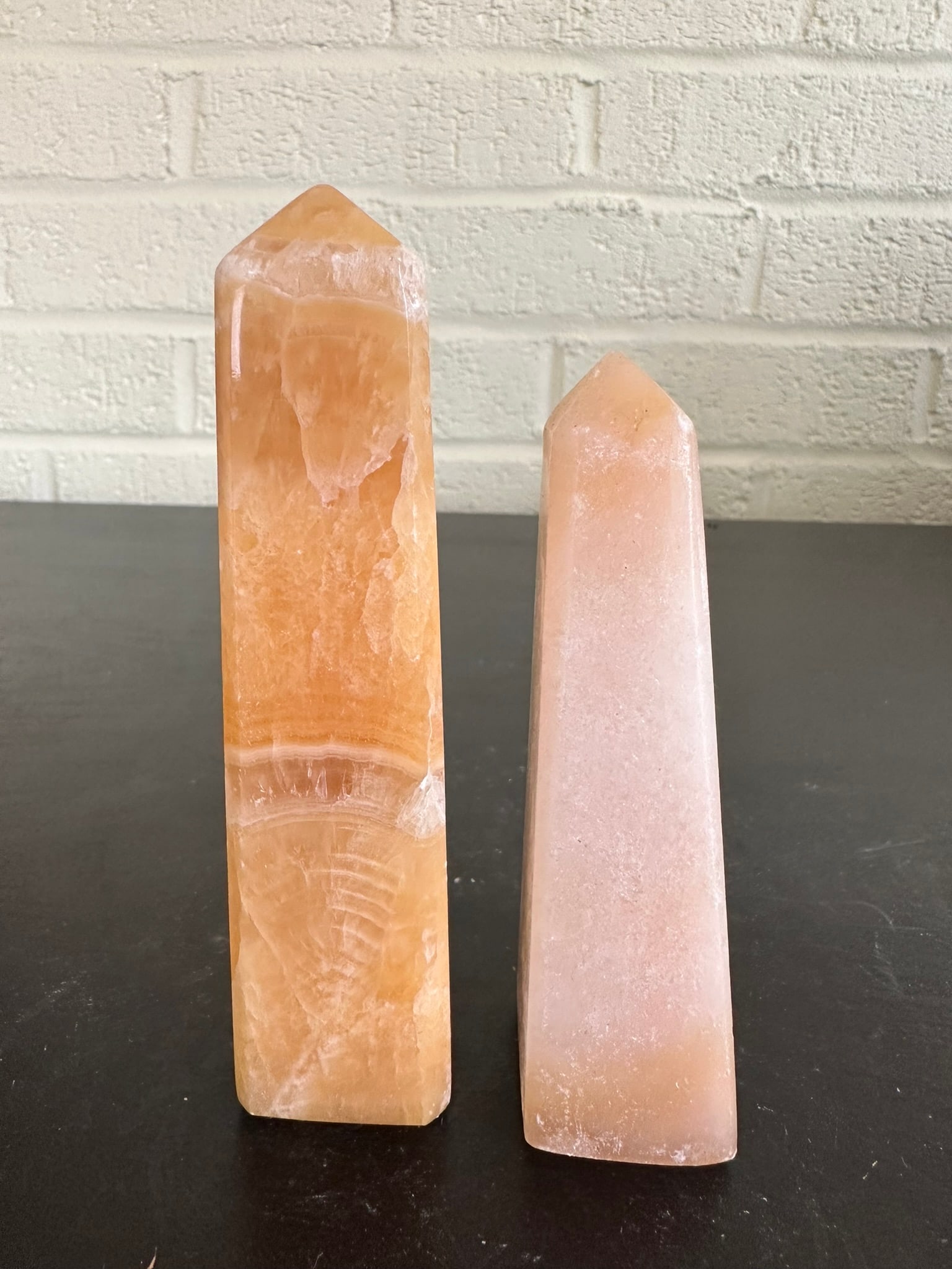 Lot of 2 Mango and milky calcite towers 0.75 lb: Lot of 2 Mango and milky calcite towers 0.75 lbs)This set of 2 towers, sourced from Afghanistan, showcases stunning natural patterns and colors. Perfect for crystal collections, home décor, or metaph