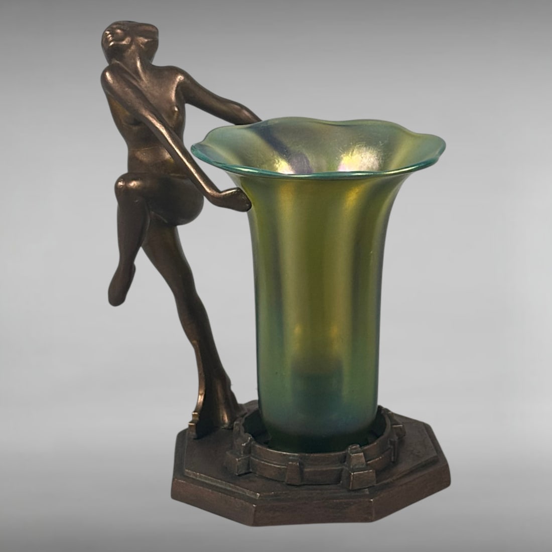 Art Deco Frankart Nude Diver Lamp with Green Iridescent Glass Shade: This exquisite Art Deco lamp by Frankart Inc. features a patinated metal base. It showcases a dynamic nude female figure in a diving pose. She elegantly supports a flared, tulip-shaped, iridescent gre