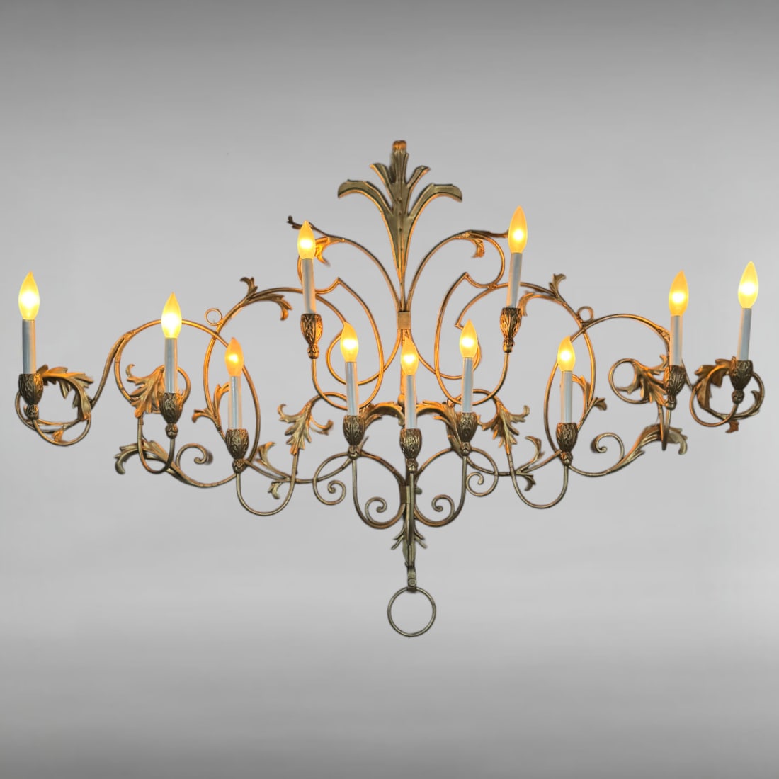 Vintage Italian Gold Finished Floral Chandelier: Vintage Italian Gold Finished Metal Chandelier This vintage Italian chandelier welcomes you with its mid-20th-century craftsmanship, featuring elaborate construction and charming floral motifs. With n