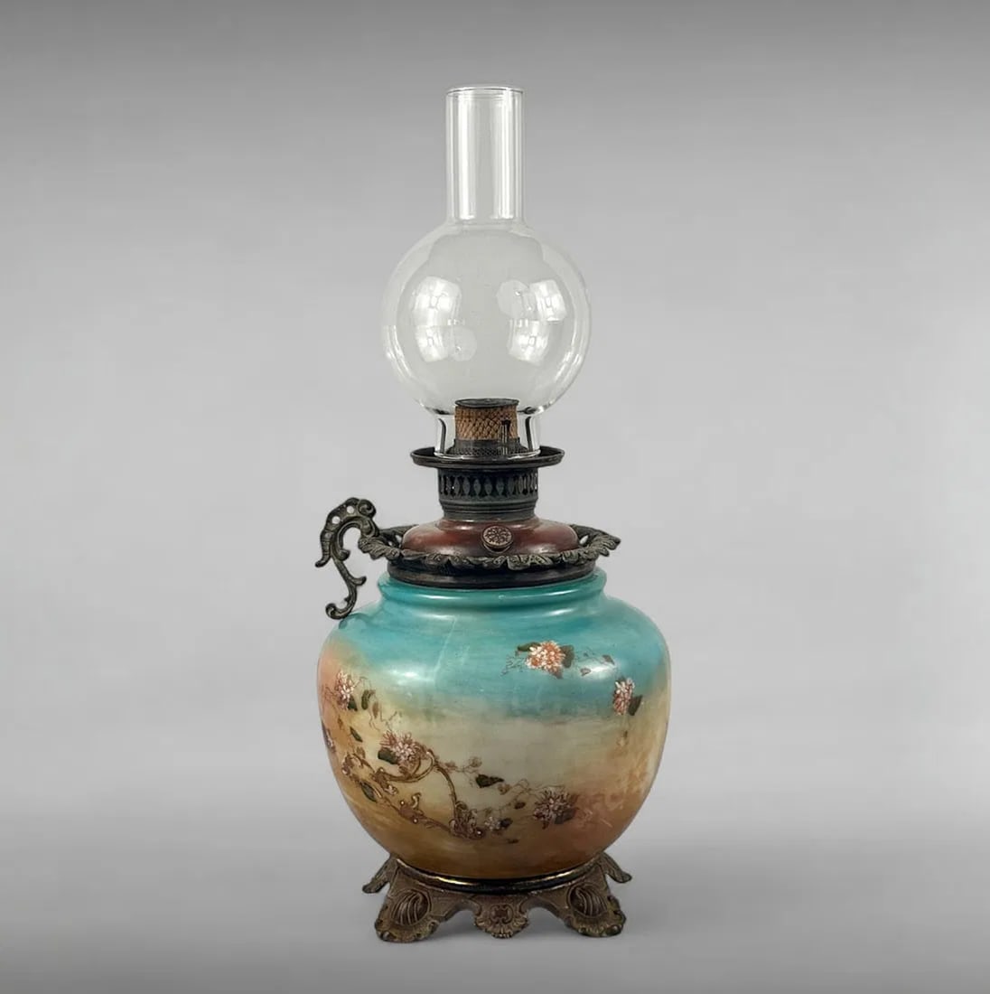 Antique The American Eureka Lamp Oil Lamp with Dragon Handle: Antique The American Eureka Lamp Oil Lamp with Dragon Handle Victorian Cast Iron & Porcelain • Dragon Handle • Patented Burner Assembly This striking Antique American Eureka lamp is a fine e