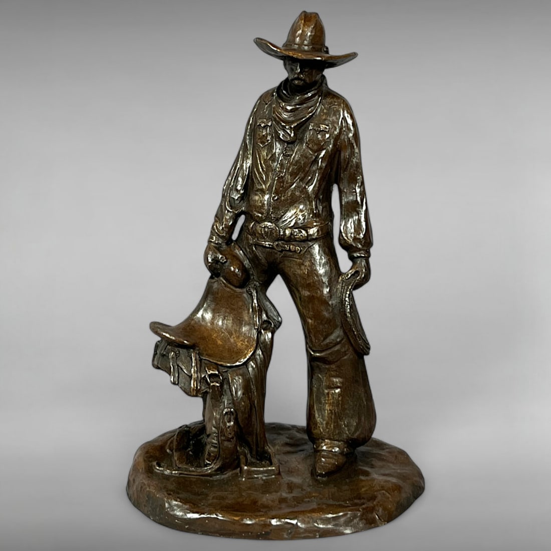 Late 20th-Century Resin Cowboy Sculpture Holding Saddle by Terri Blem (1 of 6)