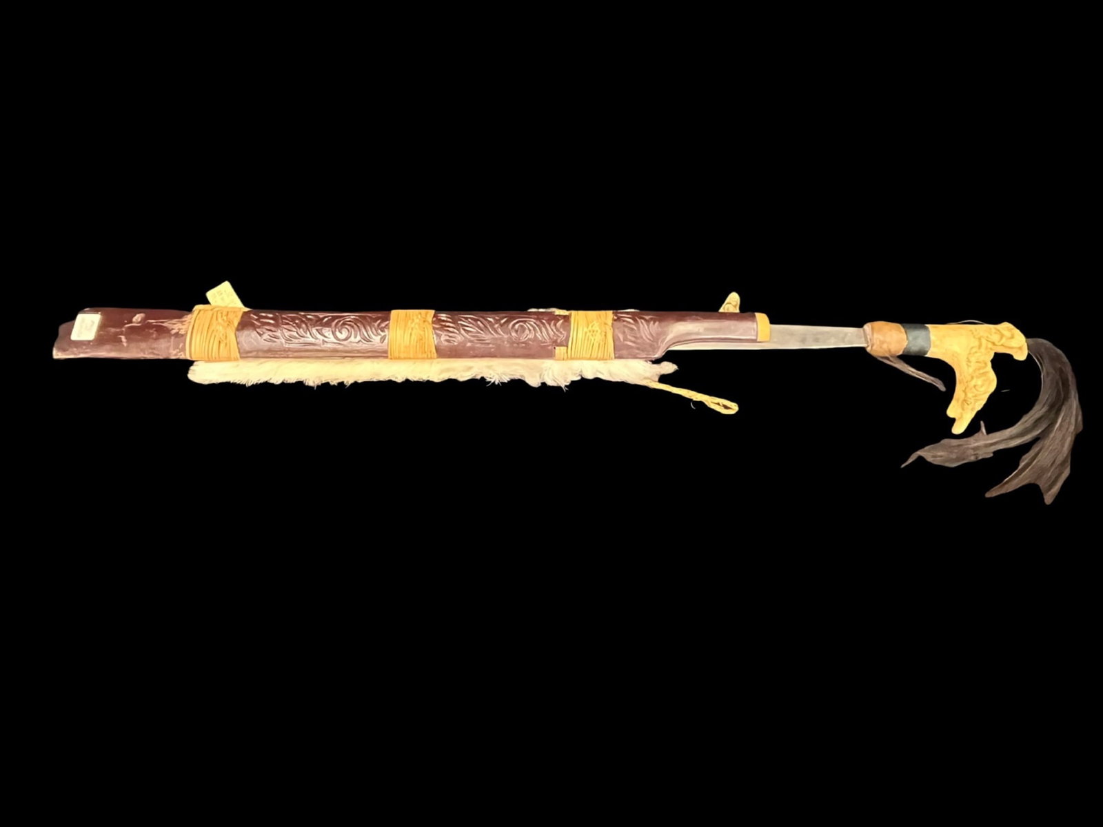 Indonesian Sword Mondau Wood: Indonesian Sword Mondau Indonesian Sword Mondau Wood Made in Indonisia Dimensions: 27”L x 5.5”W overall dimensions Sword is 24”L w/5” handle Small sword 14”L w/3.5”